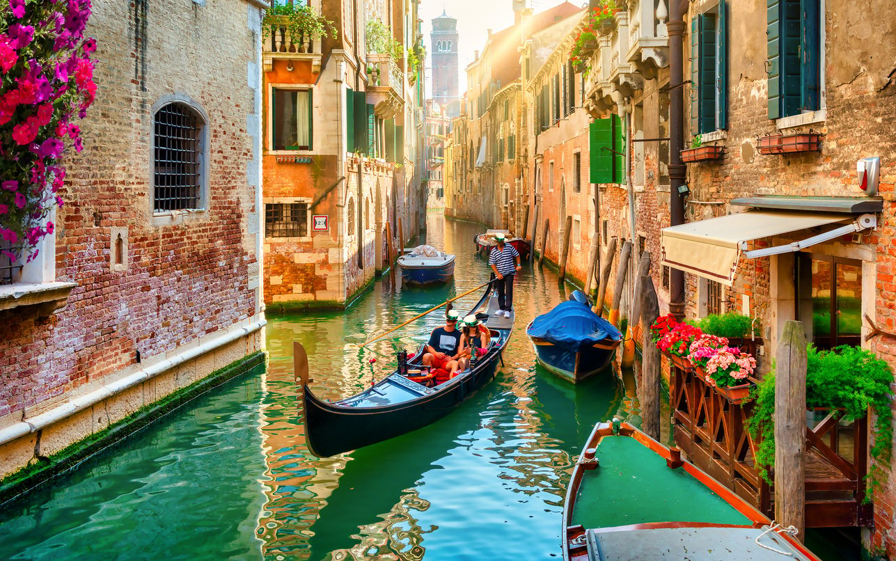 Couple Rides on Gondola at Venice Canal